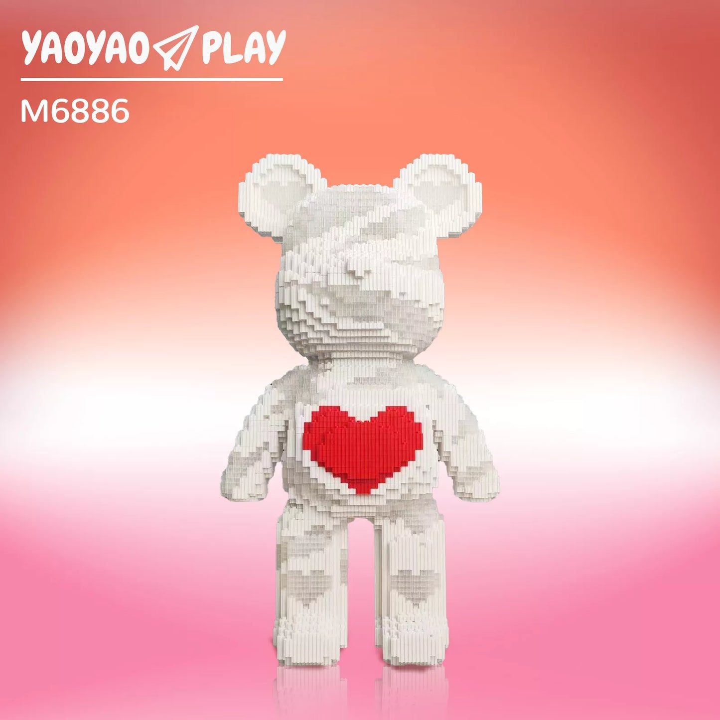 A Brick Bear toy made from recycled building blocks, paired with a kraft paper bag labeled "100% Ecographik."