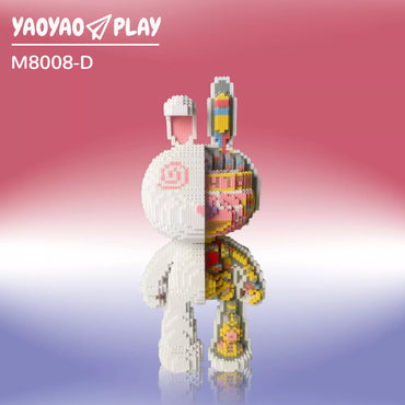 A split-design ​​Brick Bear toy​​ with minimalist white and anatomical multicolored details on a gradient backdrop.